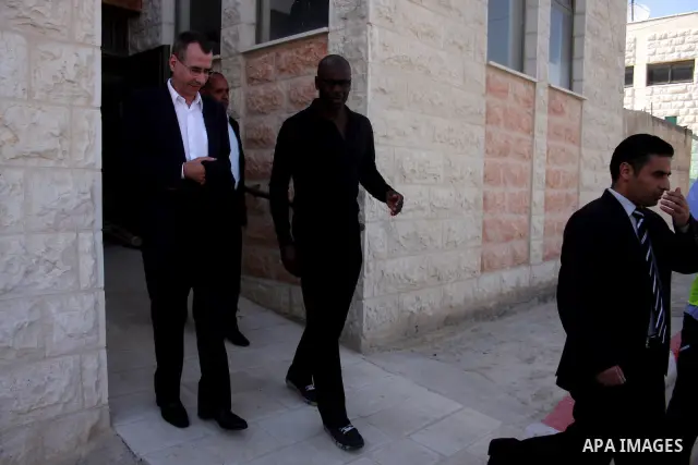 Former French football player Lilian Thuram and the Palestinian Football Association chairman Jibril Rajoub attend the inauguration of a 9,000-capacity stadium, at Al-Bireh, on the outskirts of the West Bank political an...