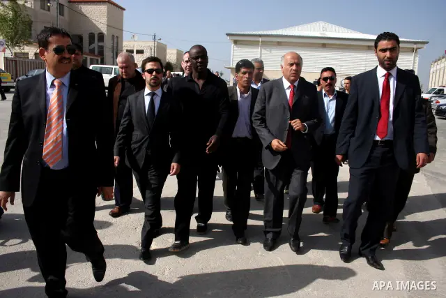 Former French football player Lilian Thuram and the Palestinian Football Association chairman Jibril Rajoub attend the inauguration of a 9,000-capacity stadium, at Al-Bireh, on the outskirts of the West Bank political an...