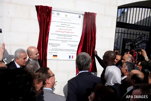 Former French football player Lilian Thuram and the Palestinian Football Association chairman Jibril Rajoub attend the inauguration of a 9,000-capacity stadium, at Al-Bireh, on the outskirts of the West Bank political an...