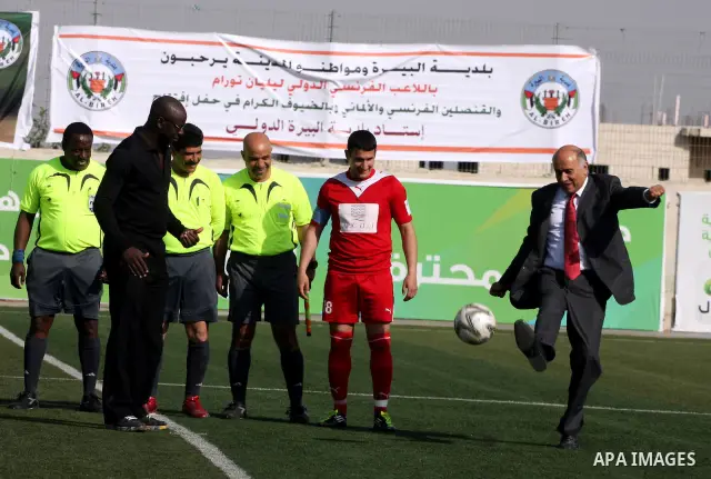 Former French football player Lilian Thuram and the Palestinian Football Association chairman Jibril Rajoub attend the inauguration of a 9,000-capacity stadium, at Al-Bireh, on the outskirts of the West Bank political an...