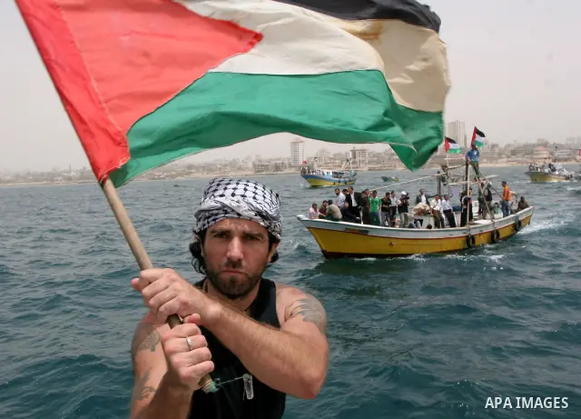This file photo taken on June 3, 2010 shows the Italian journalist Victor rides a boat during a protest at the Gaza Seaport against Israel's interception of of Gaza-bound ships. A Salafi group in Gaza kidnapped the Itali...