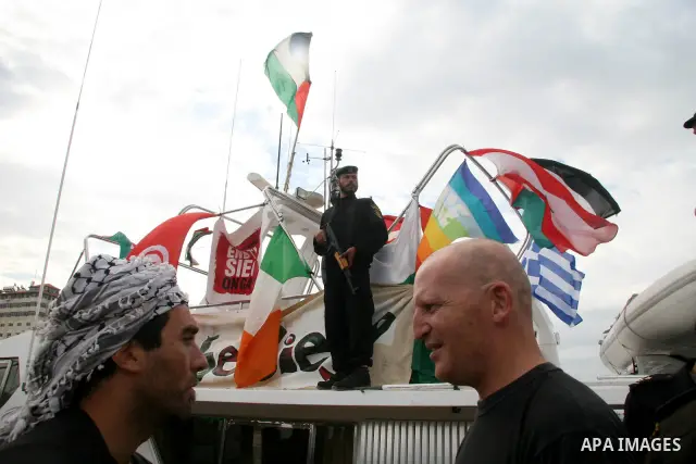 This October 29, 2008 file photo shows Italian peace activist Vittorio Arrigoni at the port in Gaza City celebrating the arrival of the 20-metre (65-foot) ship "Dignity" that departed from Cyprus the previous day to prot...