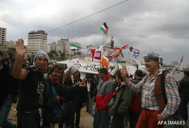 This October 29, 2008 file photo shows Italian peace activist Vittorio Arrigoni at the port in Gaza City celebrating the arrival of the 20-metre (65-foot) ship "Dignity" that departed from Cyprus the previous day to prot...