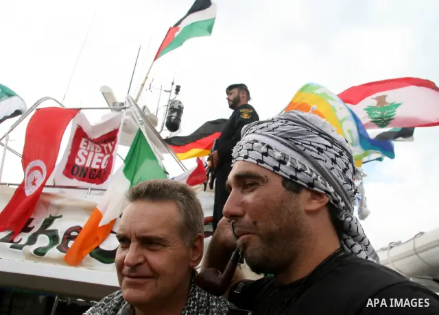 This October 29, 2008 file photo shows Italian peace activist Vittorio Arrigoni at the port in Gaza City celebrating the arrival of the 20-metre (65-foot) ship "Dignity" that departed from Cyprus the previous day to prot...