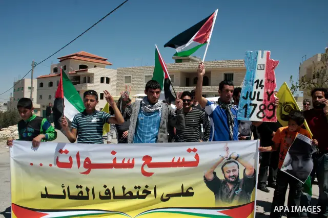 Protesters take part in a demonstration against Israel's controversial separation barrier in the West Bank village of Maasarah, near the biblical town of Bethlehem on April 15, 2011. Israel says the network of steel and...
