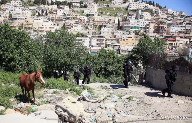 Israeli riot policemen take position in the east Jerusalem neighborhood of Silwan on April 15, 2011 following brief clashes between police and stone throwers. Photo by Sliman Khader