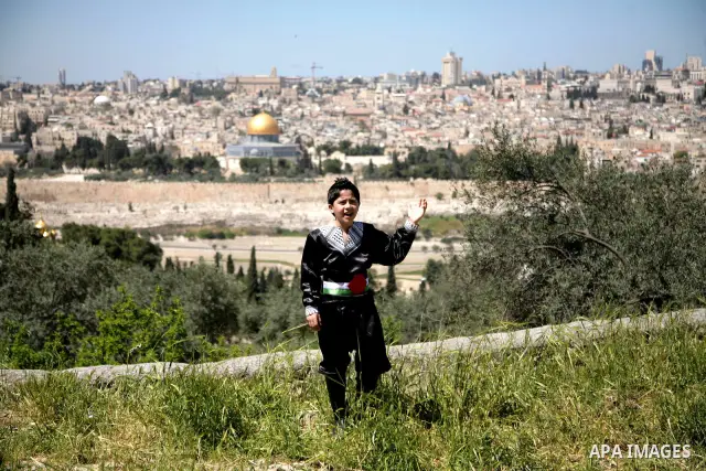 The Palestinian child Issam Bashiti, who was participated in the program Arab's got talent, delivers poetry in front of media in Jerusalem's old city on April 15,2011. The Dome of the Rock shown in the background. Photo...