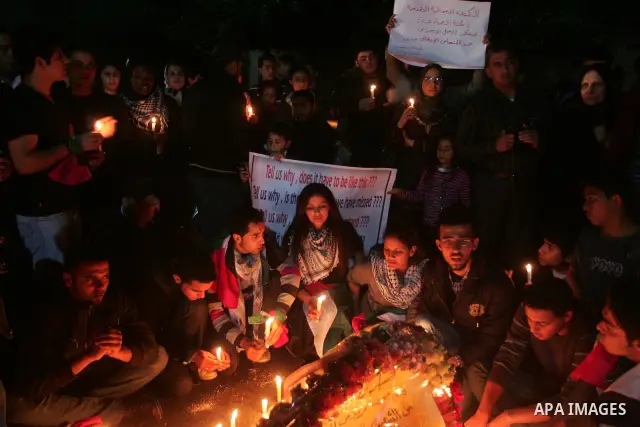 Palestinian light candles during a protest against killing of Italian activist Vittorio Arrigoni in Gaza City, 15 April 2011. Hamas authorities in the Gaza Strip condemned as a 'shameful crime' the kidnap and killing of...