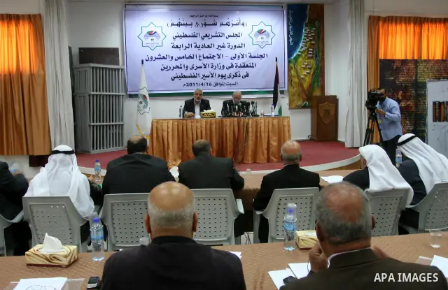 Palestinian Parliament members attend a meeting at the Prisoners Ministry headquarters to mark the Prisoner Day in Gaza city on April 16,2011. Photo by Mohammed Asad