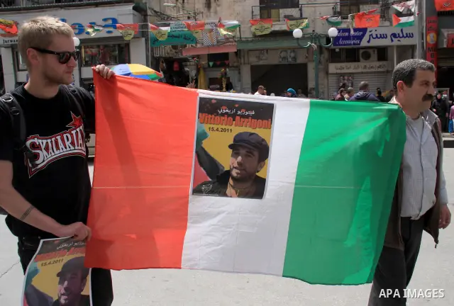 Palestinians and foreign activists take part in a protest against the killing of Italian activist Vittorio Arrigoni in the West bank city of Nablus April 16, 2011. Photo by Wagdi Eshtayah
