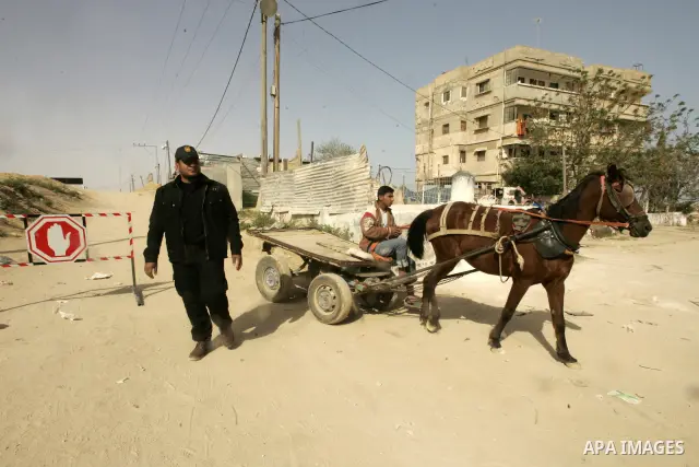 Members of Hamas' security forces patrol in the Gaza border town of Rafah, on April 16, 2011, after a radical Islamist group killed an Italian activist just hours after kidnapping him. The Hamas government said today it...