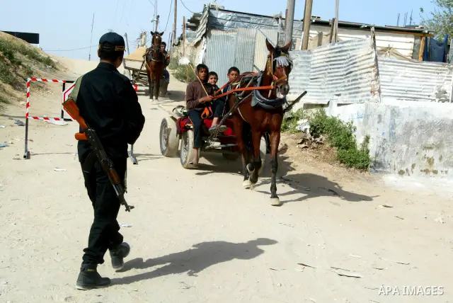 Members of Hamas' security forces patrol in the Gaza border town of Rafah, on April 16, 2011, after a radical Islamist group killed an Italian activist just hours after kidnapping him. The Hamas government said today it...
