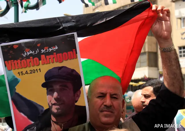 Palestinians and foreign activists take part in a protest against the killing of Italian activist Vittorio Arrigoni in the West bank city of Nablus April 16, 2011. Photo by Wagdi Eshtayah