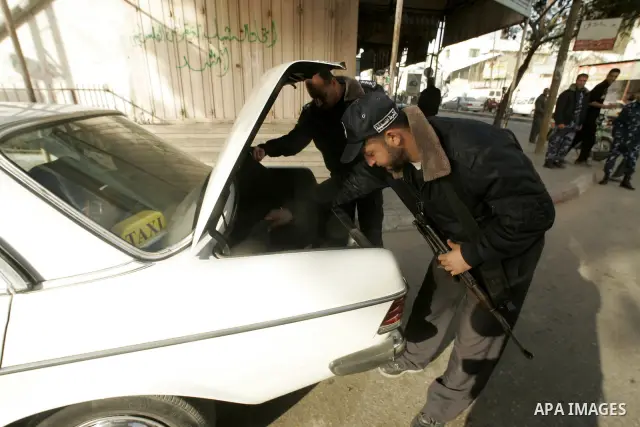Members of Hamas' security forces patrol in the Gaza border town of Rafah, on April 16, 2011, after a radical Islamist group killed an Italian activist just hours after kidnapping him. The Hamas government said today it...