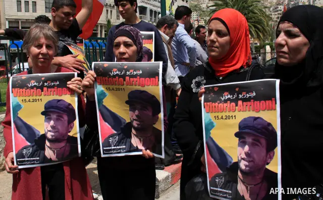Palestinians and foreign activists take part in a protest against the killing of Italian activist Vittorio Arrigoni in the West bank city of Nablus April 16, 2011. Photo by Wagdi Eshtayah