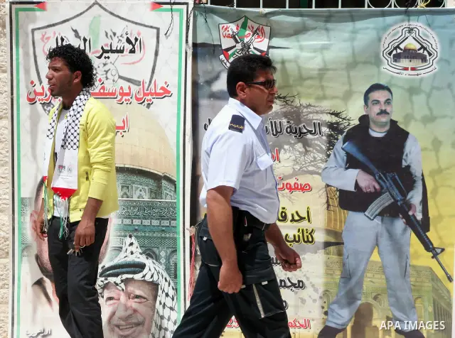 Palestinians students take part during a rally demanding the release of their loved ones from Israeli jails in Al Quds Open University in the West Bank city of Hebron, on April 16, 2011.Photo by Najeh Hashlamoun