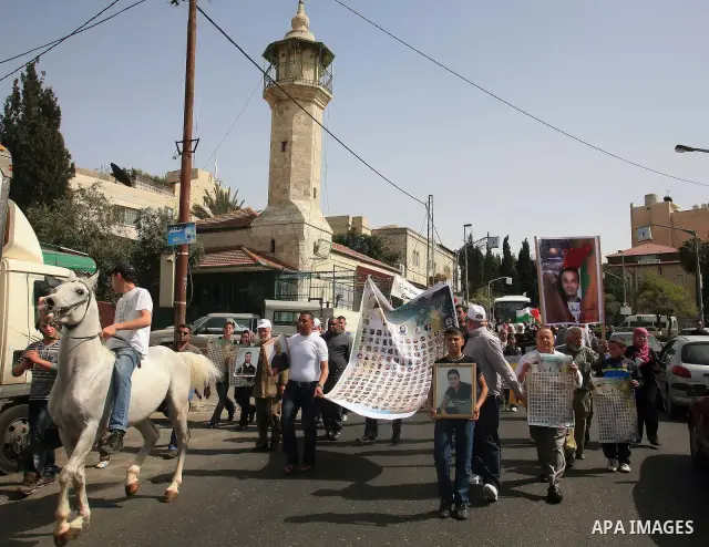 March from the Damascus Gate in East Jerusalem to the Red Cross headquarters where the Palestinian Legislative Council sitters since 290 days, demanding the release of prisoners from Israeli jails. April 16 2011. Sliman...