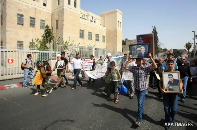 March from the Damascus Gate in East Jerusalem to the Red Cross headquarters where the Palestinian Legislative Council sitters since 290 days, demanding the release of prisoners from Israeli jails. April 16 2011. Sliman...