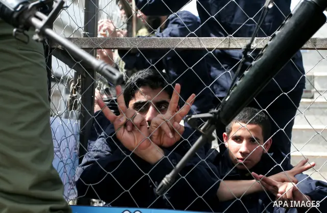 Palestinians participate in a rally, one of several taking place across the Israeli occupied West Bank and Gaza Strip, calling for the release of Palestinians being held in Israeli jails, as they mark Palestinian Prisone...