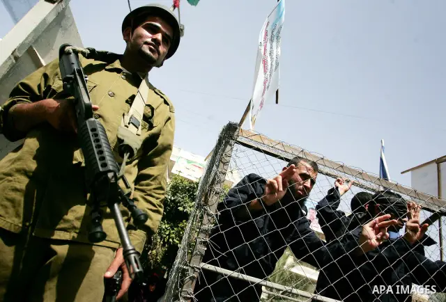 Palestinians participate in a rally, one of several taking place across the Israeli occupied West Bank and Gaza Strip, calling for the release of Palestinians being held in Israeli jails, as they mark Palestinian Prisone...