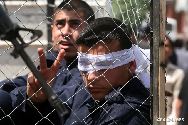 Palestinians participate in a rally, one of several taking place across the Israeli occupied West Bank and Gaza Strip, calling for the release of Palestinians being held in Israeli jails, as they mark Palestinian Prisone...