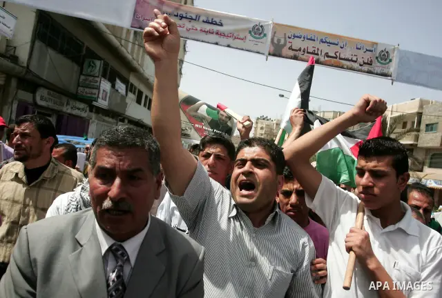 Palestinians participate in a rally, one of several taking place across the Israeli occupied West Bank and Gaza Strip, calling for the release of Palestinians being held in Israeli jails, as they mark Palestinian Prisone...