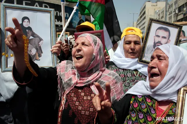 Palestinians take part in a rally, one of several taking place across the Israeli occupied West Bank and Gaza Strip calling for the release of Palestinians being held in Israeli jails, as they mark Palestinian Prisoner's...