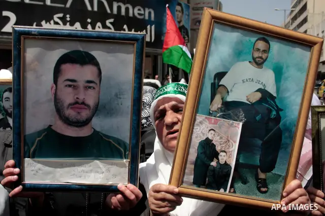 Palestinians take part in a rally, one of several taking place across the Israeli occupied West Bank and Gaza Strip calling for the release of Palestinians being held in Israeli jails, as they mark Palestinian Prisoner's...