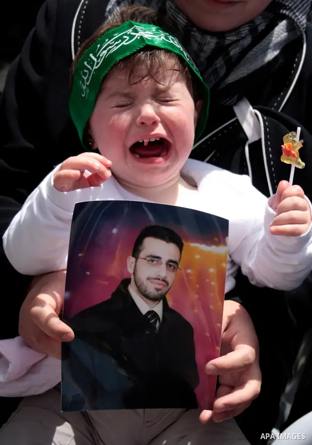 Palestinians take part in a rally, one of several taking place across the Israeli occupied West Bank and Gaza Strip calling for the release of Palestinians being held in Israeli jails, as they mark Palestinian Prisoner's...