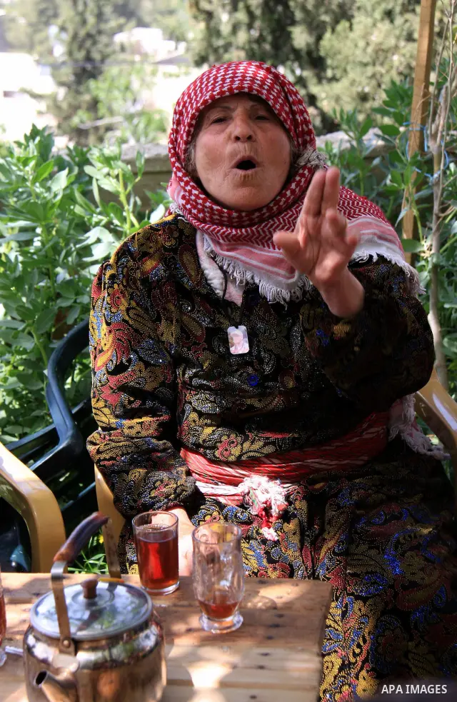 A Palestinian relative of Hakim Awad talks to the media in her house in the West Bank village of Awarta near Nablus City on 17 April 2011. Israel has arrested Awad and his cousin in connection with the deadly stabbing of...