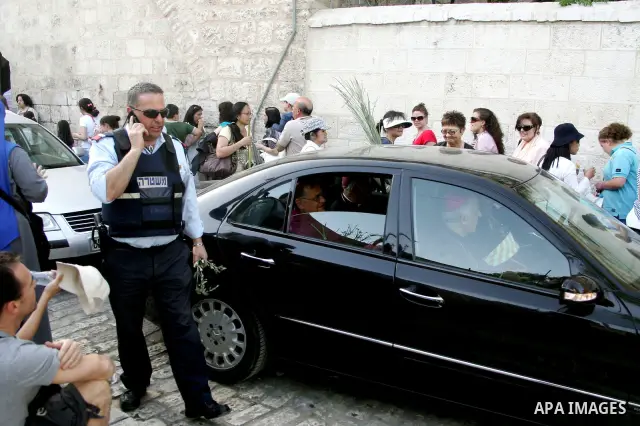 Christian pilgrims take part the Palm Sunday procession from Mt. Olives into Jerusalem's old city on April 17, 2011, marking the triumphant return of Jesus Christ to Jerusalem when a cheering crowd greeted him waving pal...