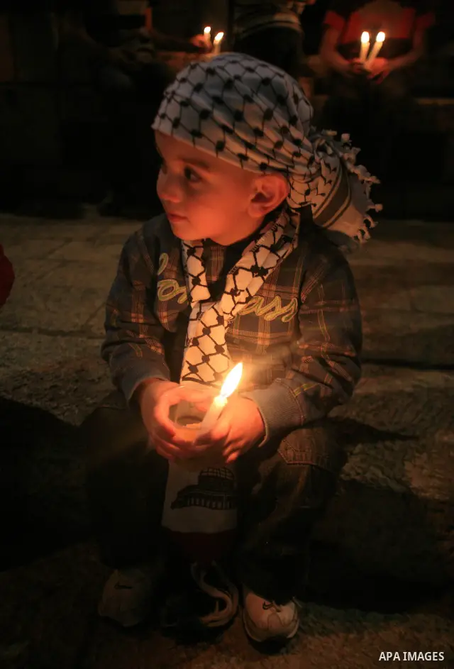 Palestinians light candles during a protest to mark Prisoner's Day in front Damascus Gate in Jerusalem's old city, Sunday, April 17, 2011. Some 5,500 Palestinians are held in Israeli prisons according to figures compiled...