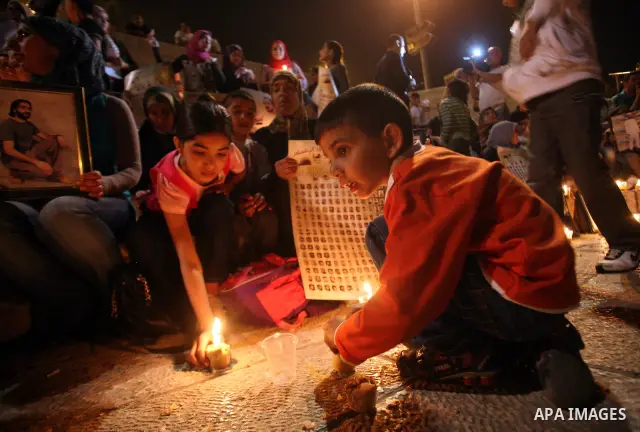 Palestinians light candles during a protest to mark Prisoner's Day in front Damascus Gate in Jerusalem's old city, Sunday, April 17, 2011. Some 5,500 Palestinians are held in Israeli prisons according to figures compiled...
