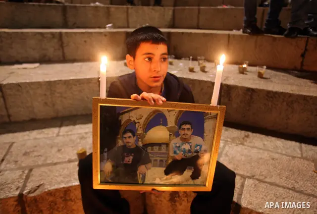 Palestinians light candles during a protest to mark Prisoner's Day in front Damascus Gate in Jerusalem's old city, Sunday, April 17, 2011. Some 5,500 Palestinians are held in Israeli prisons according to figures compiled...
