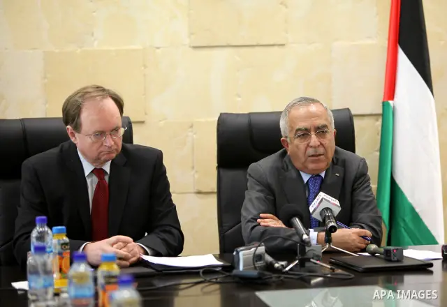 Palestinian Pime Minister, Salam Fayyad signing a financial agreement to support the infrastructure with the European Union in the West Bank city of Ramallah on April 19,2011. Photo by Mustafa Abu Dayeh