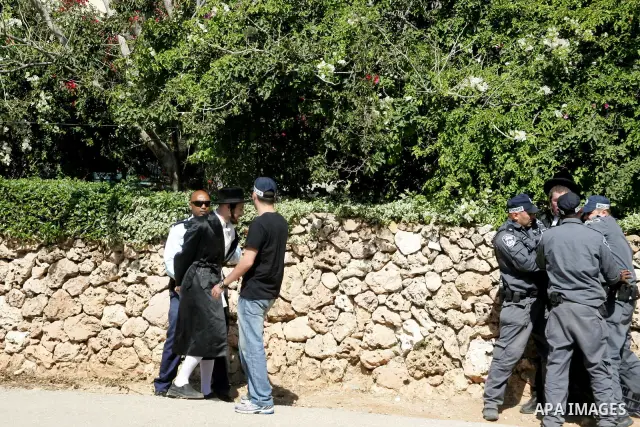 Ultra-Orthodox demonstrators scuffle with police during a protest near Tel Aviv April 21, 2011. protest against the excavation of graves. photo by MAhfouz Abu Turk