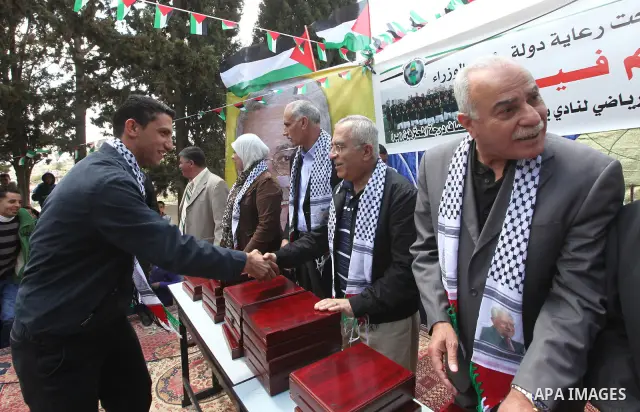 Palestinian Pime Minister, Salam Fayyad during a ceremony honoring the football team "Btillo". which Qualify round of the degree of professional "B". in West Bank city of Ramallah on April 23,2011. Photo by Mustafa Abu D...