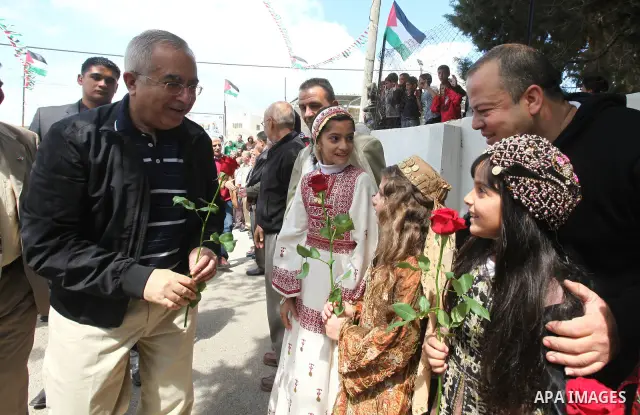 Palestinian Pime Minister, Salam Fayyad during a ceremony honoring the football team "Btillo". which Qualify round of the degree of professional "B". in West Bank city of Ramallah on April 23,2011. Photo by Mustafa Abu D...