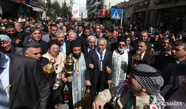 Palestinian Prime Minister, Salam Fayyad participates on the Holy Saturday in the West Bank city of Ramallah on April 23, 2011. Photo by Mustafa Abu Dayeh