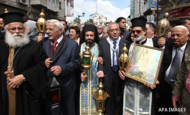 Palestinian Prime Minister, Salam Fayyad participates on the Holy Saturday in the West Bank city of Ramallah on April 23, 2011. Photo by Mustafa Abu Dayeh