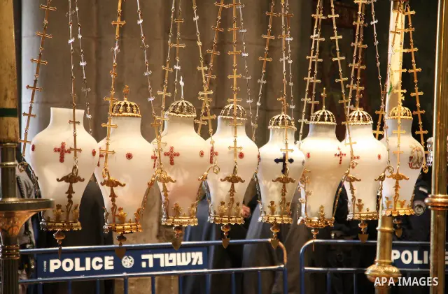 Christians Orthodox take part in Easter "Holy Fire" celebrations on the eve of Easter Sunday on April 23, 2011, at the Church of the Holy Sepulchre, built over the sites where Christians believe Christ was crucified and...