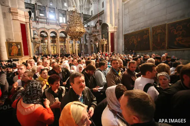 Christians Orthodox take part in Easter "Holy Fire" celebrations on the eve of Easter Sunday on April 23, 2011, at the Church of the Holy Sepulchre, built over the sites where Christians believe Christ was crucified and...