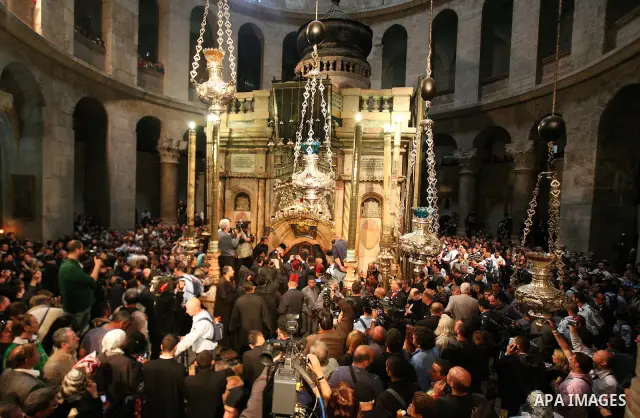 Christians Orthodox take part in Easter "Holy Fire" celebrations on the eve of Easter Sunday on April 23, 2011, at the Church of the Holy Sepulchre, built over the sites where Christians believe Christ was crucified and...