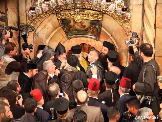 Christians Orthodox take part in Easter "Holy Fire" celebrations on the eve of Easter Sunday on April 23, 2011, at the Church of the Holy Sepulchre, built over the sites where Christians believe Christ was crucified and...