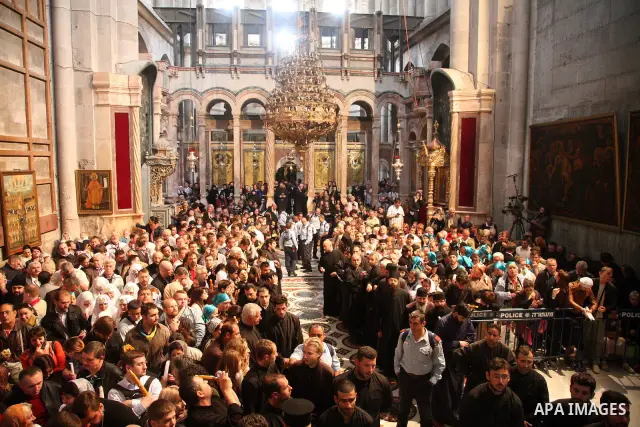 Christians Orthodox take part in Easter "Holy Fire" celebrations on the eve of Easter Sunday on April 23, 2011, at the Church of the Holy Sepulchre, built over the sites where Christians believe Christ was crucified and...