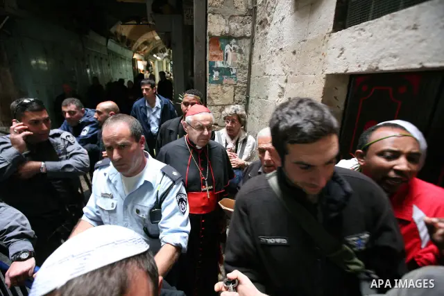 Christians Orthodox take part in Easter "Holy Fire" celebrations on the eve of Easter Sunday on April 23, 2011, outside the Church of the Holy Sepulchre, built over the sites where Christians believe Christ was crucified...