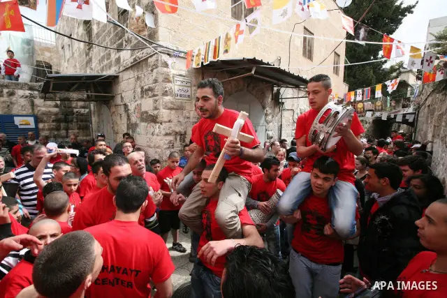 Christians Orthodox take part in Easter "Holy Fire" celebrations on the eve of Easter Sunday on April 23, 2011, outside the Church of the Holy Sepulchre, built over the sites where Christians believe Christ was crucified...