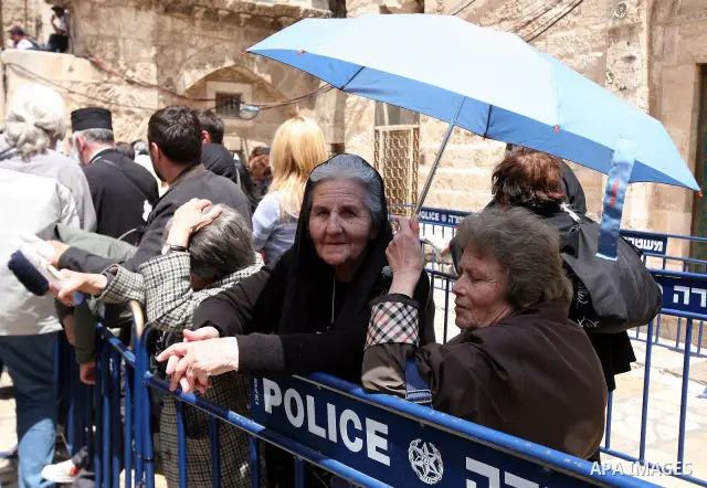 Israeli soldiers stand guard as Christians Orthodox take part in Easter "Holy Fire" celebrations on the eve of Easter Sunday on April 23, 2011, outside the Church of the Holy Sepulchre, built over the sites where Christi...