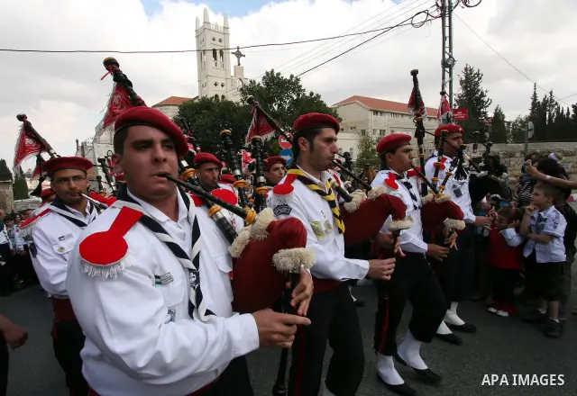 Christians take part in the opening of the Easter Vigil on Holy Saturday late April 23, 2011 in the West Bank town of Beit Jala. Christians of the western church are making their preparations for tomorrow's Easter celebr...