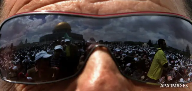 Palestinians take part in a celebration " The box of Al Aqsa child" in front of the Dome of the Rock on the compound known to Muslims as al-Haram al-Sharif, and to Jews as Temple Mount in Jerusalem's Old City on April 23...